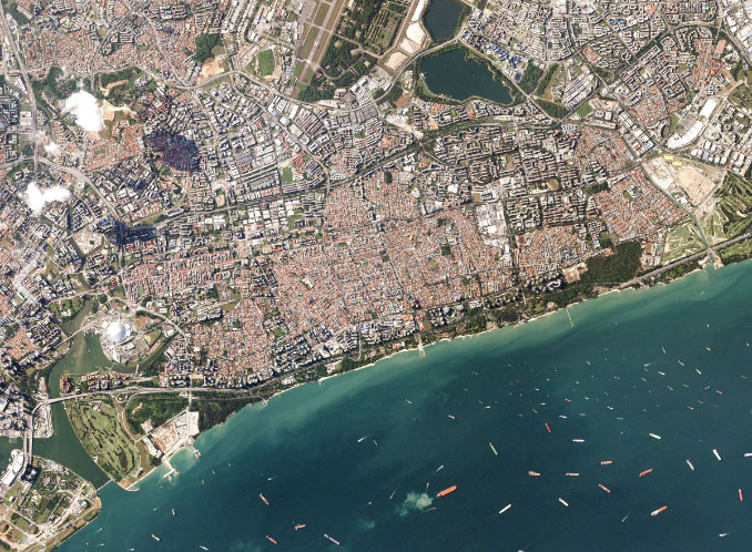 Satellite imagery providing baseline context for near real-time human activity change detection in an urban coastal area.